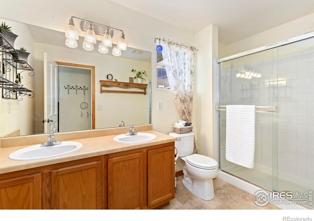 633 Deerwood Dr, Longmont, CO 80504 - bathroom featuring double vanity, a shower stall, and tile patterned flooring