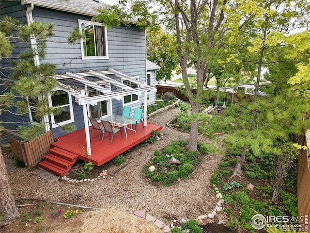 823 Timothy Dr, Longmont, CO 80503 - back of property with a deck, a shingled roof, and outdoor dining area