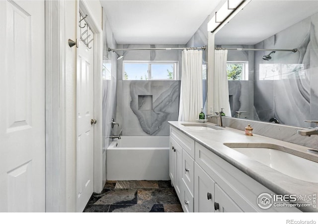 823 Timothy Dr, Longmont, CO 80503 - full bath with shower / bathtub combination with curtain, double vanity, and stone tile flooring