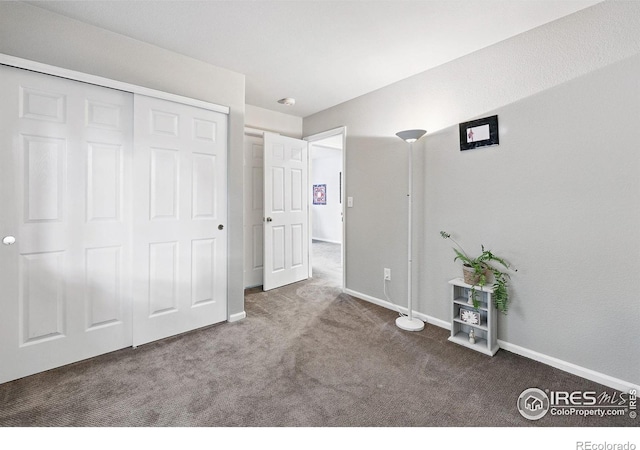 823 Timothy Dr, Longmont, CO 80503 - unfurnished bedroom with carpet floors, baseboards, and a closet