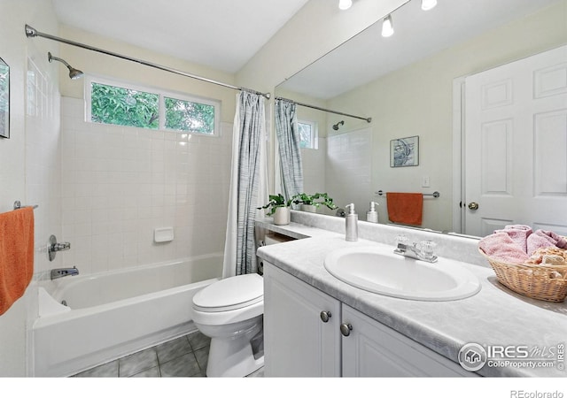 823 Timothy Dr, Longmont, CO 80503 - bathroom with shower / tub combo, vanity, toilet, and tile patterned flooring