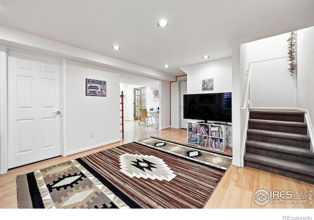 823 Timothy Dr, Longmont, CO 80503 - living room featuring light wood-style floors, stairway, recessed lighting, and baseboards