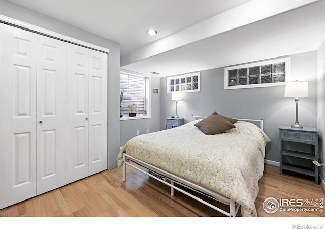 823 Timothy Dr, Longmont, CO 80503 - bedroom featuring wood finished floors, recessed lighting, a closet, and baseboards