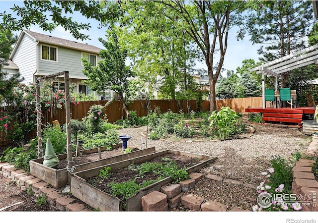 823 Timothy Dr, Longmont, CO 80503 - fenced backyard featuring a garden, a wooden deck, and a pergola