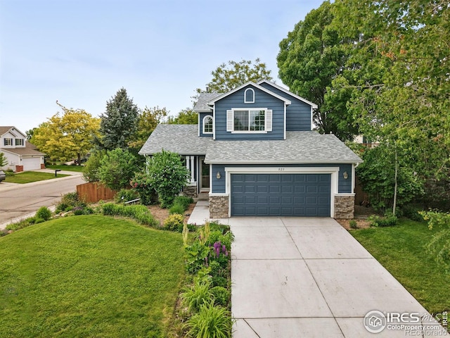 823 Timothy Dr, Longmont, CO 80503 - view of front of home with stone siding, an attached garage, concrete driveway, and a shingled roof