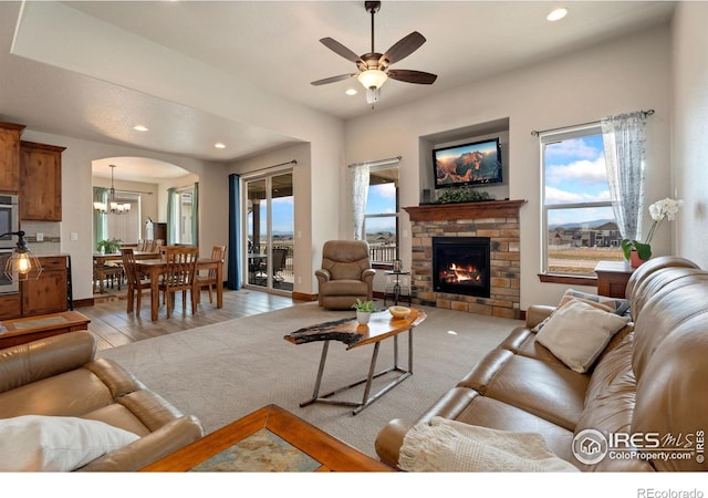 5532 Maidenhead Dr, Windsor, CO 80550 - living area with plenty of natural light, recessed lighting, a chandelier, ceiling fan, and light wood finished floors