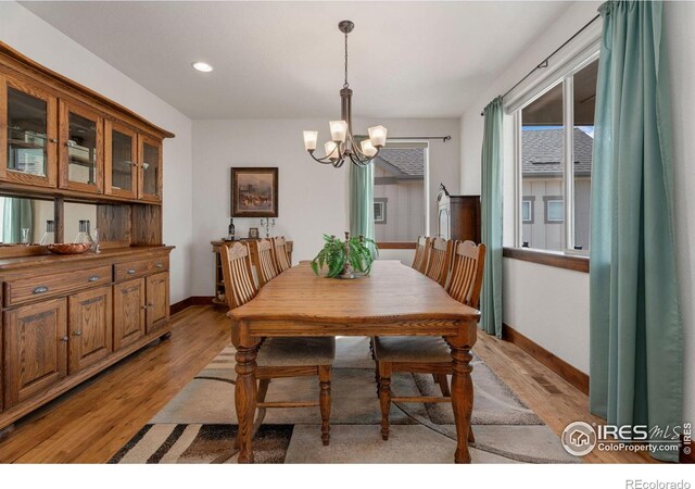 5532 Maidenhead Dr, Windsor, CO 80550 - dining area with a chandelier, baseboards, light wood-type flooring, and recessed lighting