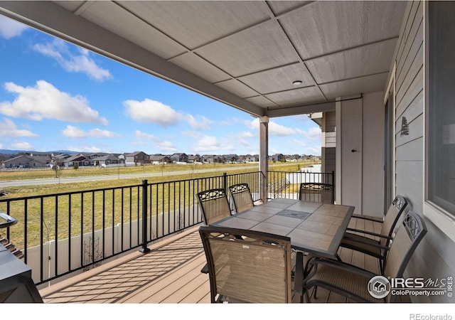 5532 Maidenhead Dr, Windsor, CO 80550 - deck with a residential view, a lawn, and outdoor dining space