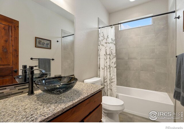 5532 Maidenhead Dr, Windsor, CO 80550 - bathroom with vanity, toilet, shower / bathtub combination with curtain, and tile patterned floors