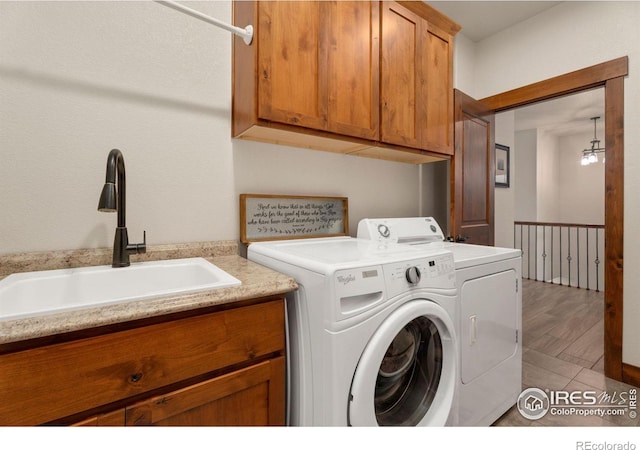 5532 Maidenhead Dr, Windsor, CO 80550 - washroom featuring washing machine and dryer and cabinet space