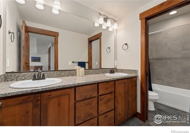 5532 Maidenhead Dr, Windsor, CO 80550 - bathroom featuring toilet, double vanity, tile patterned flooring, and bathing tub / shower combination
