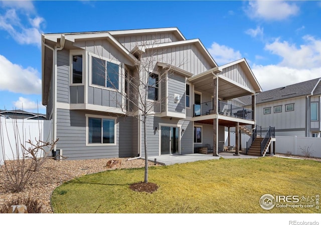 5532 Maidenhead Dr, Windsor, CO 80550 - back of house with board and batten siding, a patio, and stairs