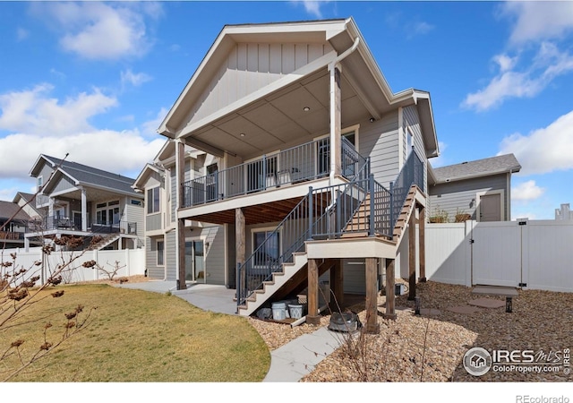 5532 Maidenhead Dr, Windsor, CO 80550 - back of property featuring a gate, stairway, and a patio area