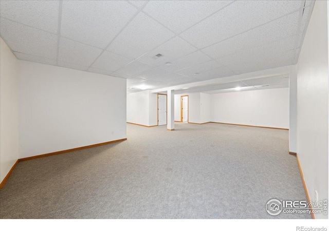 2615 Anemonie Dr, Loveland, CO 80537 - finished basement with carpet flooring, baseboards, and a paneled ceiling