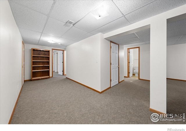 2615 Anemonie Dr, Loveland, CO 80537 - finished below grade area with a drop ceiling, carpet flooring, and baseboards