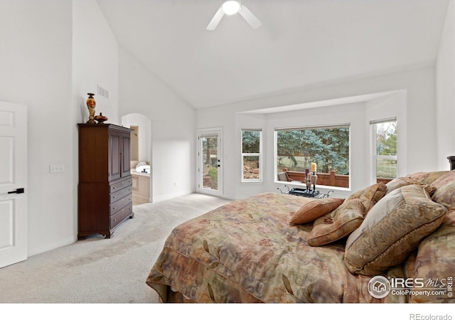 2549 Cowley Dr, Lafayette, CO 80026 - bedroom featuring light colored carpet, high vaulted ceiling, multiple windows, and baseboards