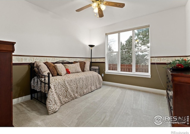 2549 Cowley Dr, Lafayette, CO 80026 - bedroom with carpet floors, a wainscoted wall, baseboards, and ceiling fan