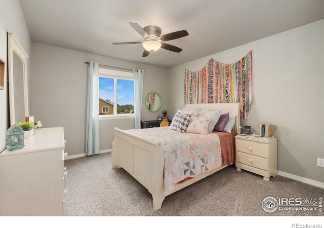 426 Gannet Peak Dr, Windsor, CO 80550 - bedroom with light colored carpet, baseboards, and ceiling fan