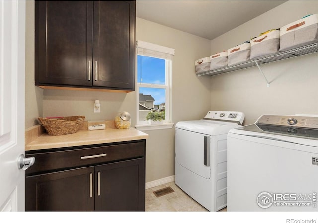 426 Gannet Peak Dr, Windsor, CO 80550 - laundry room with washing machine and clothes dryer, cabinet space, and baseboards