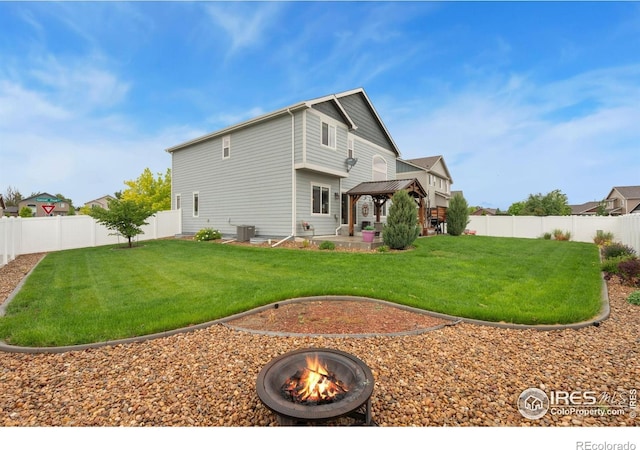 426 Gannet Peak Dr, Windsor, CO 80550 - rear view of house featuring a gazebo, an outdoor fire pit, cooling unit, and a patio area