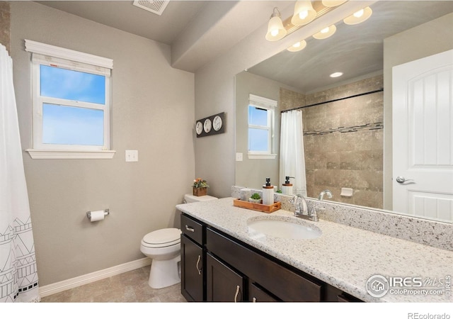 426 Gannet Peak Dr, Windsor, CO 80550 - bathroom with toilet, vanity, baseboards, tiled shower, and tile patterned flooring