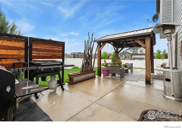426 Gannet Peak Dr, Windsor, CO 80550 - fenced backyard with a gazebo, a patio, area for grilling, and an outdoor living space