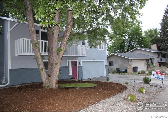 1714 Zeus Dr, Lafayette, CO 80026 - view of front facade featuring an attached garage and concrete driveway