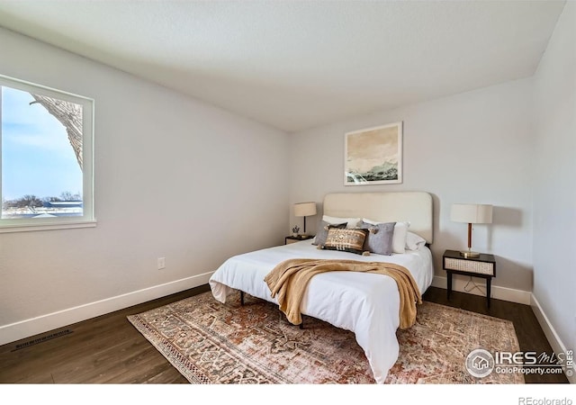 1714 Zeus Dr, Lafayette, CO 80026 - bedroom featuring wood finished floors and baseboards
