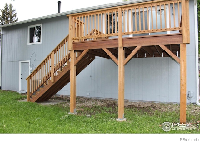 1714 Zeus Dr, Lafayette, CO 80026 - view of home's exterior featuring stairway, a wooden deck, a yard, and a carport
