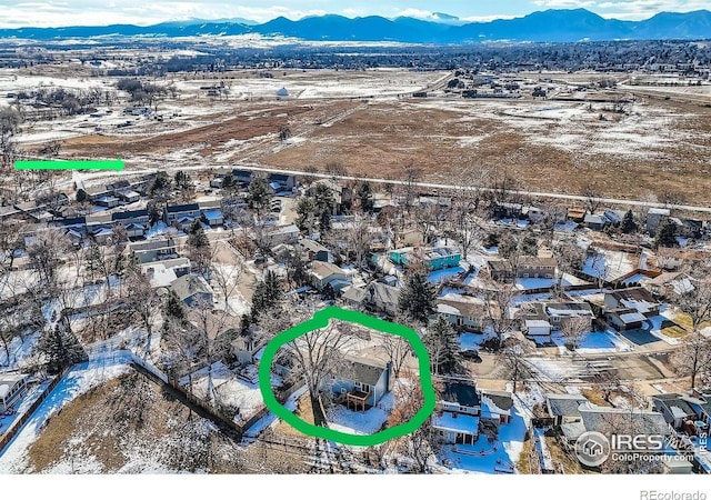 1714 Zeus Dr, Lafayette, CO 80026 - snowy aerial view featuring a mountain view and a residential view