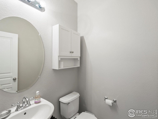 4795 Raven Run, Broomfield, CO 80023 - half bathroom with toilet and a sink