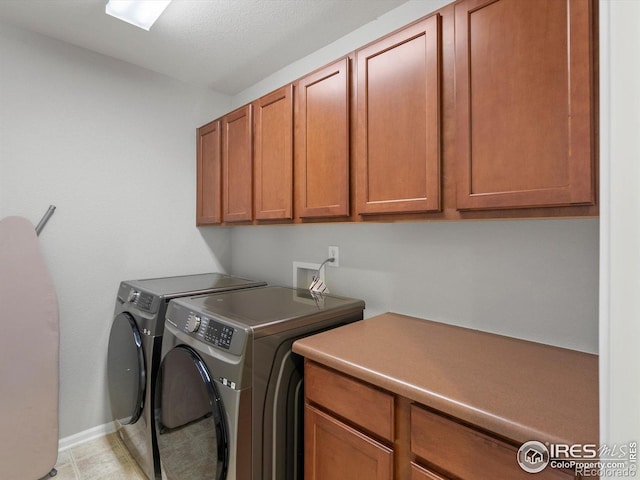 4795 Raven Run, Broomfield, CO 80023 - washroom with cabinet space, washing machine and clothes dryer, and baseboards