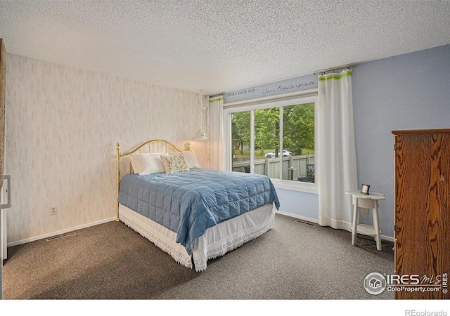 2409 Flora Dr, Loveland, CO 80537 - bedroom with carpet flooring, a textured ceiling, baseboards, and wallpapered walls