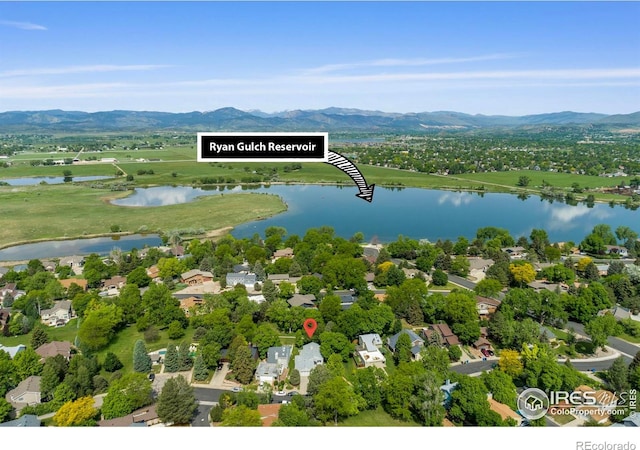 2409 Flora Dr, Loveland, CO 80537 - drone / aerial view of a water and mountain view