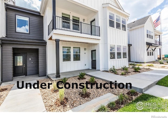1811 Bounty Dr Unit 4, Windsor, CO 80550 - view of front of property with a balcony and board and batten siding