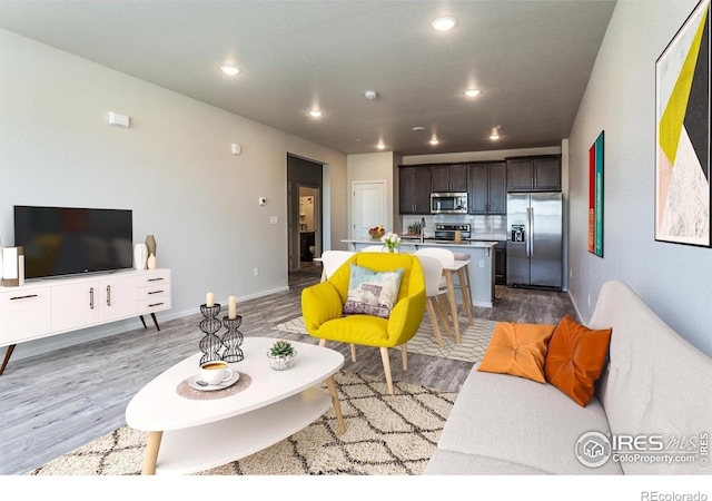 1811 Bounty Dr Unit 4, Windsor, CO 80550 - living area with wood finished floors, recessed lighting, and baseboards