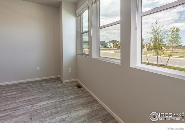 1811 Bounty Dr Unit 4, Windsor, CO 80550 - empty room with wood finished floors and baseboards