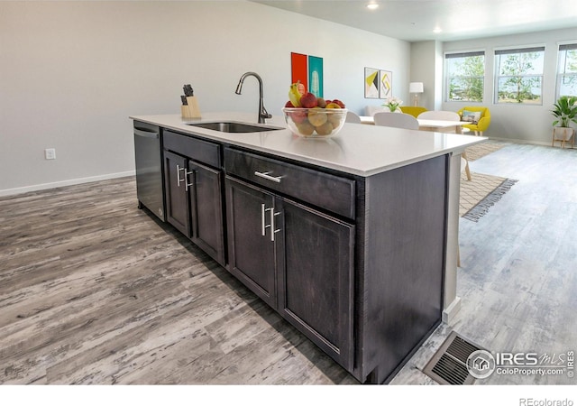 1811 Bounty Dr Unit 4, Windsor, CO 80550 - kitchen with a sink, dishwasher, light wood finished floors, open floor plan, and recessed lighting