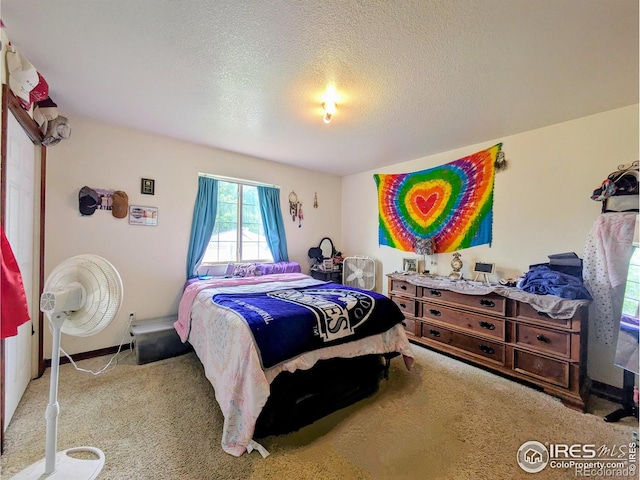 112-114 8th St, Gilcrest, CO 80623 - carpeted bedroom featuring a textured ceiling