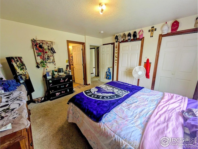 112-114 8th St, Gilcrest, CO 80623 - bedroom with light carpet and a textured ceiling
