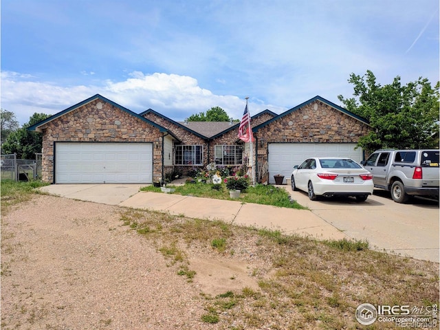 112-114 8th St, Gilcrest, CO 80623 - ranch-style house with a garage, concrete driveway, and stone siding