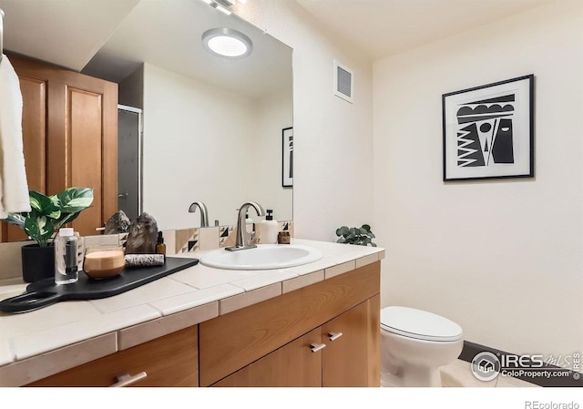 2245 Blake St Unit D, Denver, CO 80205 - bathroom featuring vanity, an enclosed shower, and tile patterned flooring