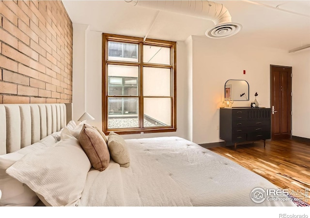 2245 Blake St Unit D, Denver, CO 80205 - bedroom with wood finished floors and baseboards