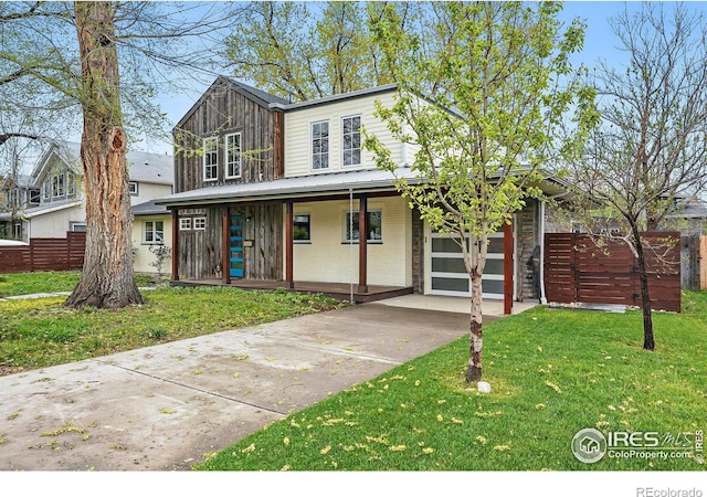2970 21st St, Boulder, CO 80304 - view of front of property with driveway, brick siding, covered porch, and a garage