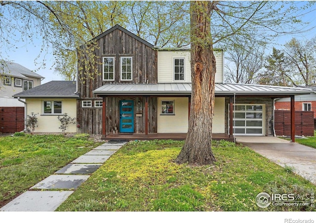 2970 21st St, Boulder, CO 80304 - view of front facade featuring a standing seam roof, brick siding, metal roof, and covered porch