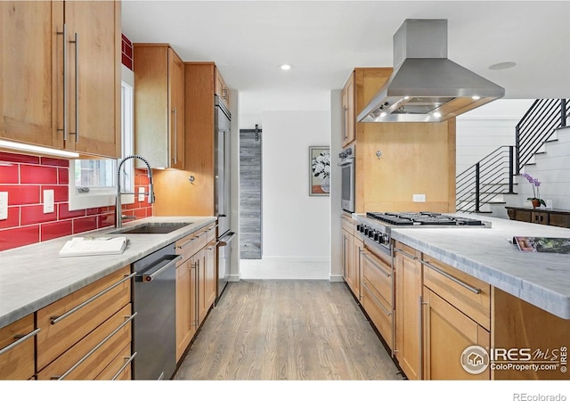 2970 21st St, Boulder, CO 80304 - kitchen featuring island exhaust hood, a sink, stainless steel appliances, backsplash, and light wood-style floors