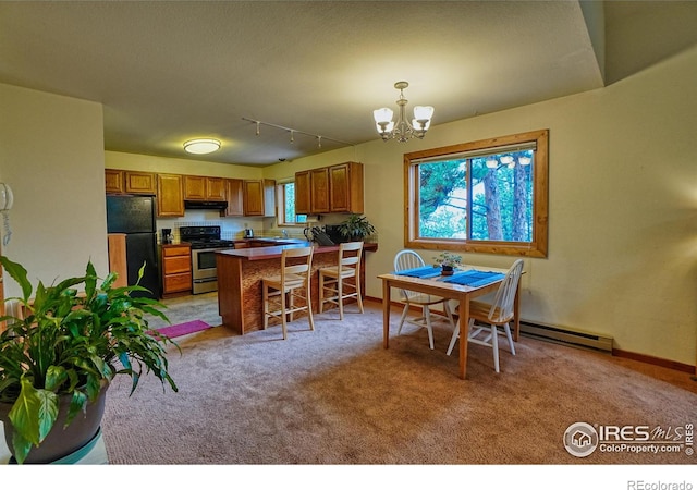 38 Navajo Trl, Nederland, CO 80466 - kitchen featuring freestanding refrigerator, stainless steel range oven, exhaust hood, and brown cabinetry