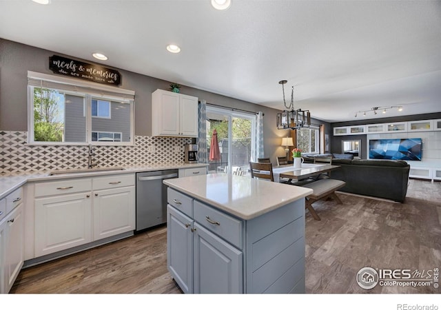 5822 Shenandoah Ave, Firestone, CO 80504 - kitchen featuring stainless steel dishwasher, a sink, white cabinets, light countertops, and recessed lighting