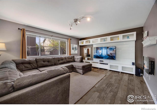 5822 Shenandoah Ave, Firestone, CO 80504 - living area featuring wood finished floors