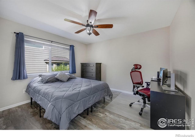 5822 Shenandoah Ave, Firestone, CO 80504 - bedroom featuring an office area, wood finished floors, baseboards, and a ceiling fan